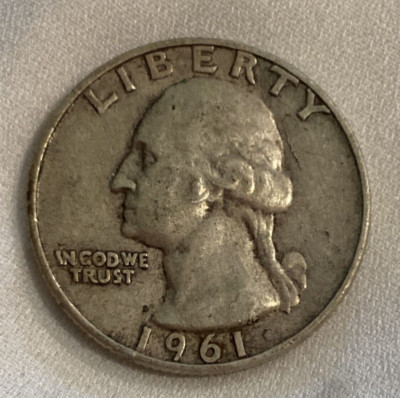 1961 Washington Quarter off-center strike error showing approximately 30% off-center misalignment with partial obverse design and blank planchet area